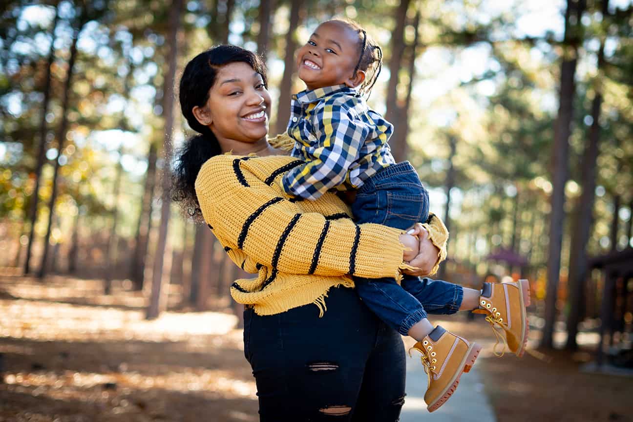 Family Lifestyle Mom Holding Son Fall Pines - Spring Lake, NC